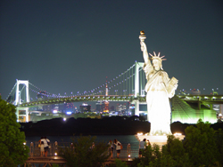 Statue of Liberty lit up at night