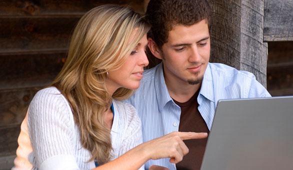 Young Couple Working on a Laptop