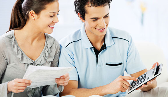 Young Couple Saving Money at Home